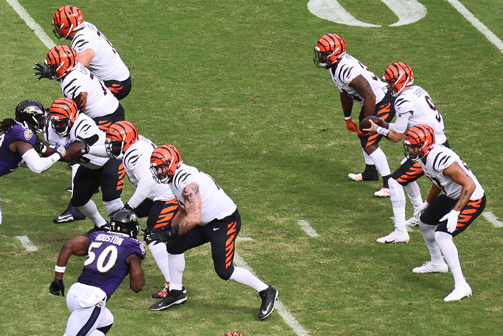 Joe Burrow and the Cincinnati Bengals offense line up during a 2021 game against the Baltimore Ravens.