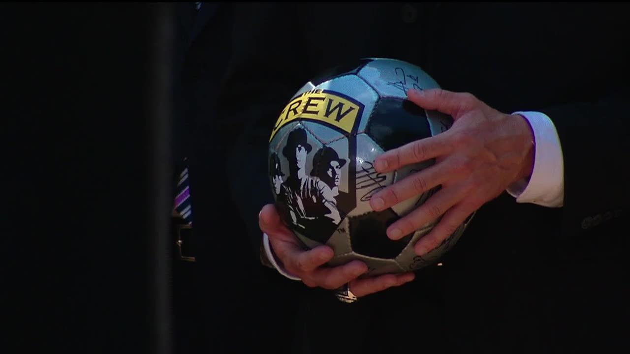 President Barack Obama holds a Columbus Crew soccer ball during the club's 2009 White House visit.